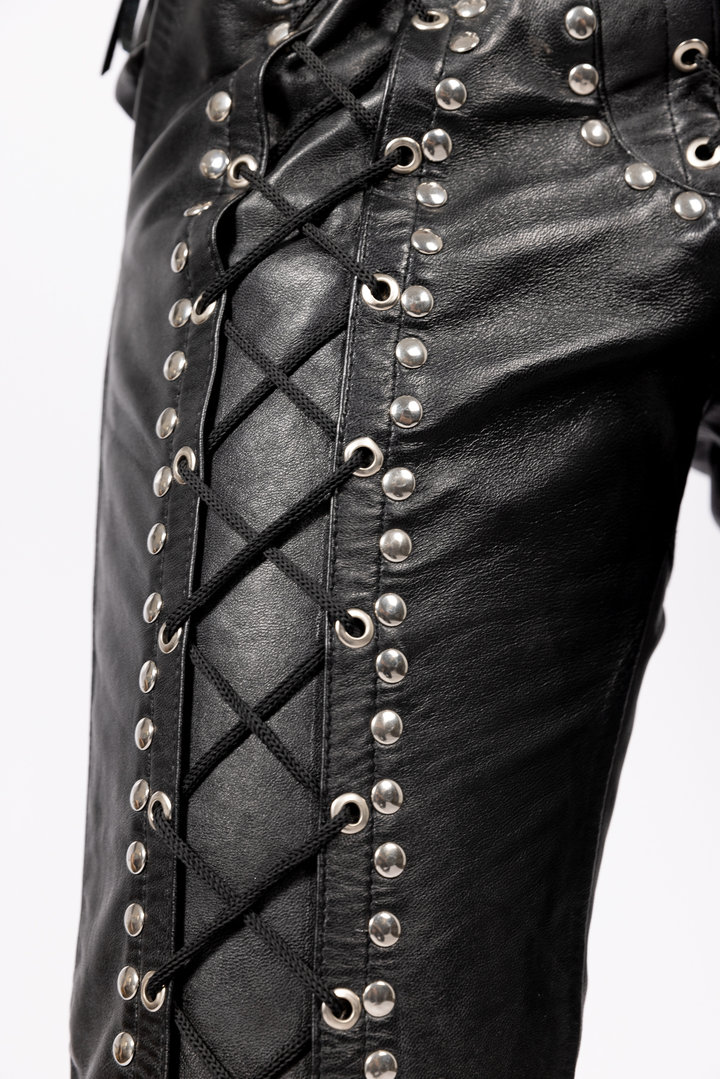 Leather trousers in genuine leather with lacing and rivets