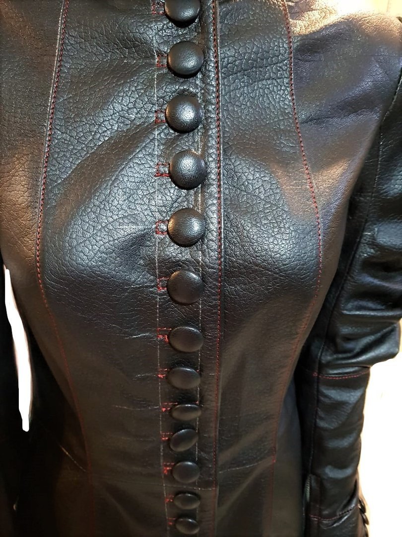 Leather dress with puff sleeves in a tight style